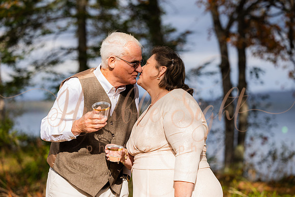 King Hewes wedding on dock at Cold Stream Pond in Enfield Maine