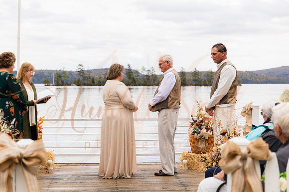 King Hewes wedding on dock at Cold Stream Pond in Enfield Maine