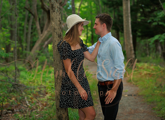 Golden hour engagement portraits in open field in Maine