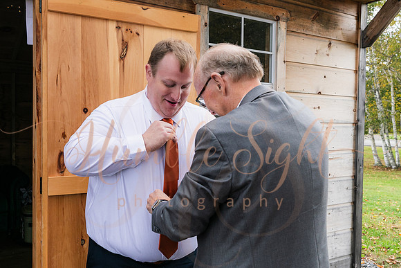 Bride and groom laughing during Maine wedding reception