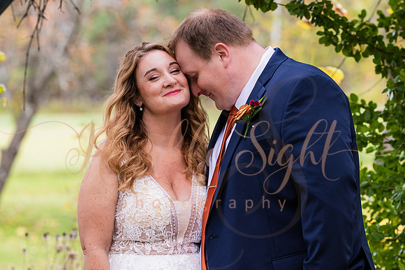 Bride and groom laughing during Maine wedding reception