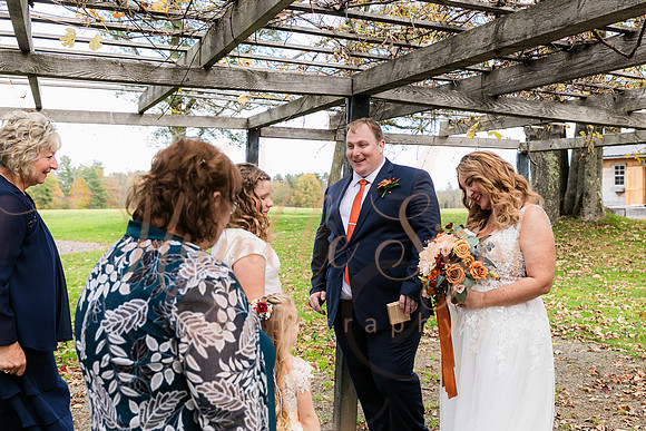 Bride and groom laughing during Maine wedding reception
