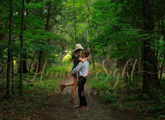 Couple embracing at sunset during Maine engagement shoot
