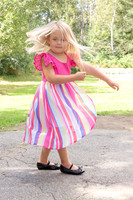 Children walking down aisle at backyard Maine wedding