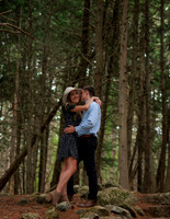 Joyful engagement session in wooded Maine setting