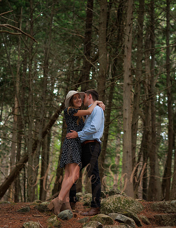 Joyful engagement session in wooded Maine setting