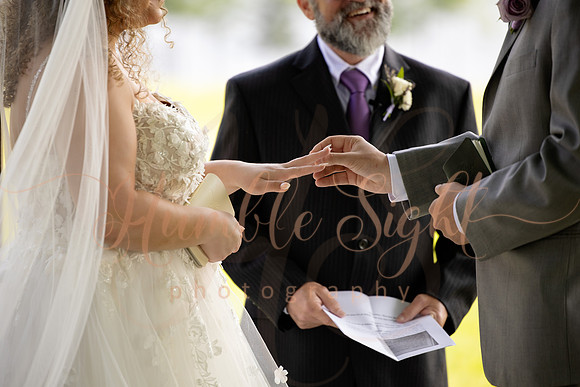 Bride and groom portraits by the water at Grace on the Lake