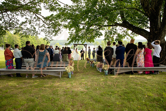 Bride and groom portraits by the water at Grace on the Lake