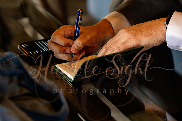 Bride and groom portraits by the water at Grace on the Lake