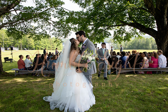 Bride and groom portraits by the water at Grace on the Lake