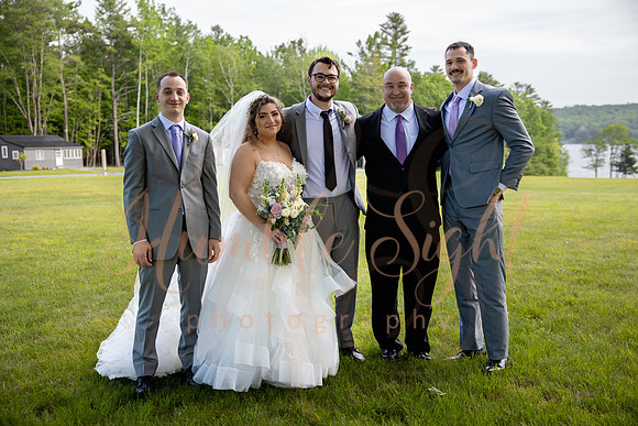 Bride and groom portraits by the water at Grace on the Lake