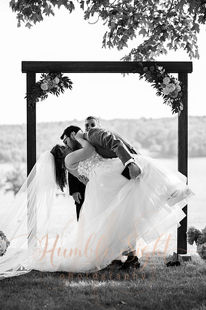 Bride and groom portraits by the water at Grace on the Lake