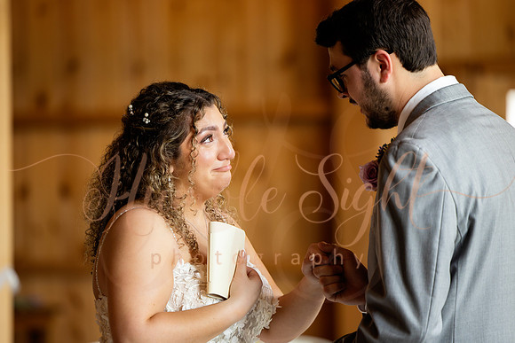 Bride and groom portraits by the water at Grace on the Lake