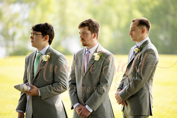 Bride and groom portraits by the water at Grace on the Lake