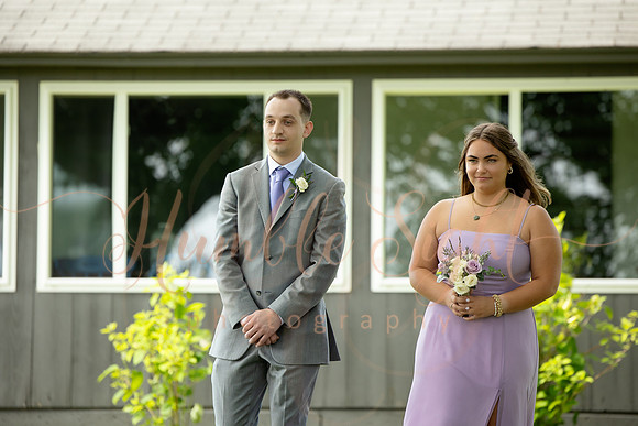 Bride and groom portraits by the water at Grace on the Lake