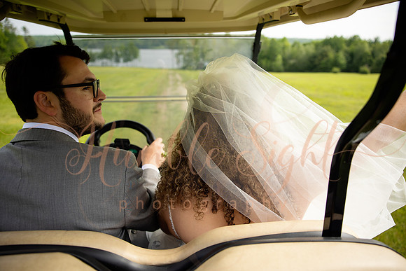 Bride and groom portraits by the water at Grace on the Lake