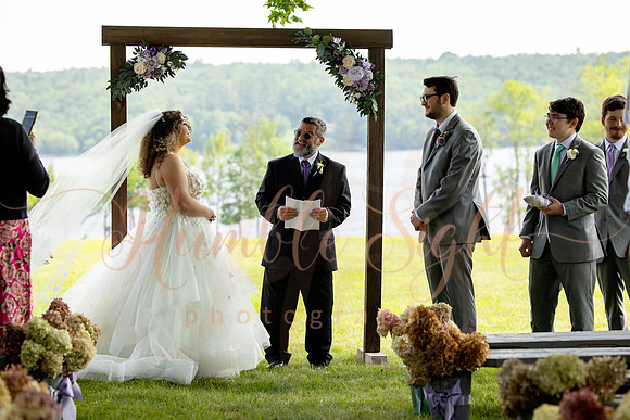Bride and groom portraits by the water at Grace on the Lake