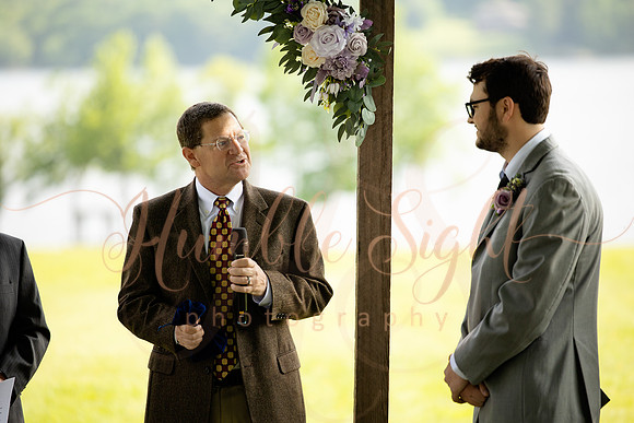 Bride and groom portraits by the water at Grace on the Lake
